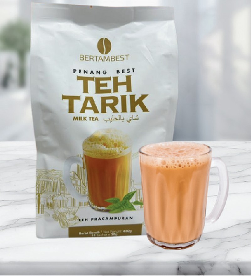 Penang Best Teh Tarik premix pack with a freshly pulled glass of milk tea